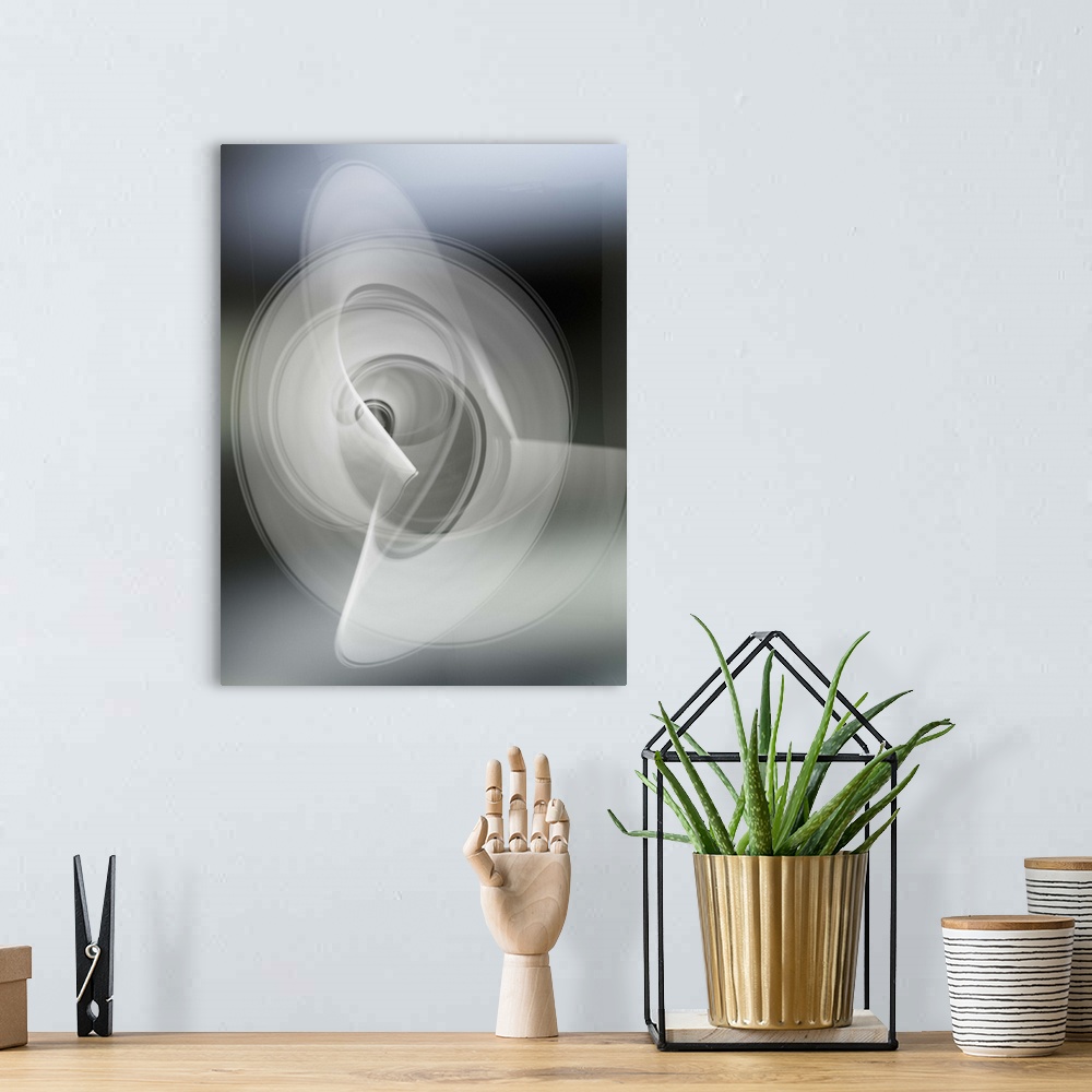 A bohemian room featuring Light trails creating an abstract white swirling circle pattern on a gray background