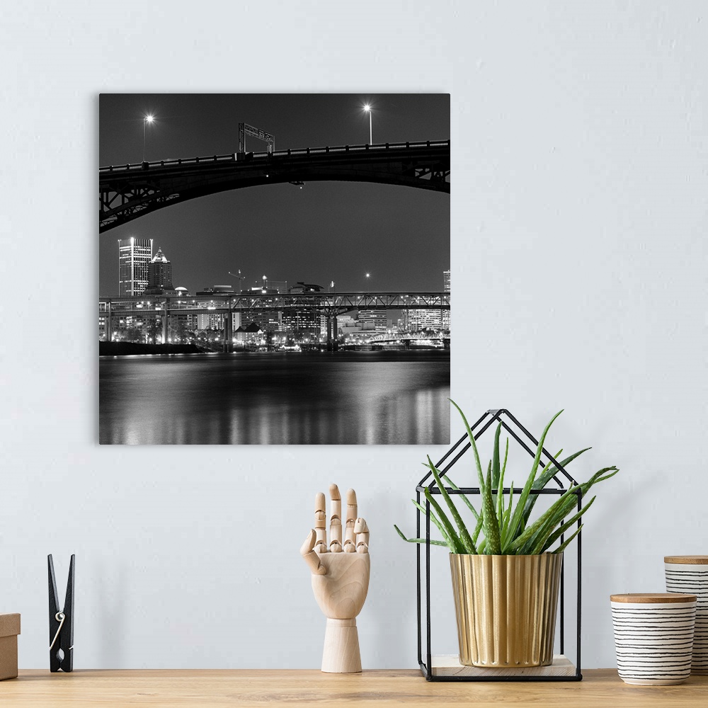 A bohemian room featuring Ross Island bridge at night with city of Portland, Oregon in background, US.