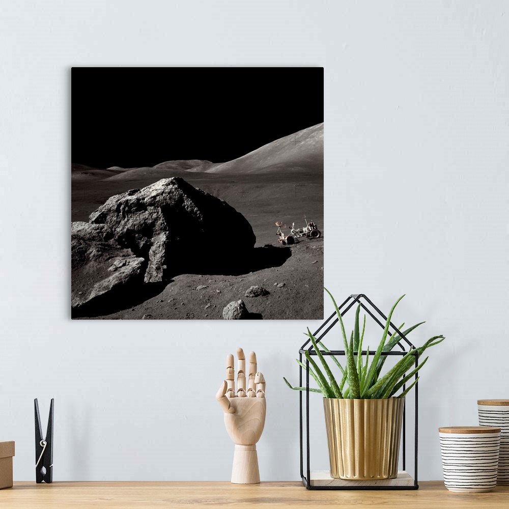 A bohemian room featuring The Apollo 17 lunar rover sits on a slope near a large rock in the Moon's Taurus-Littrow Valley. ...