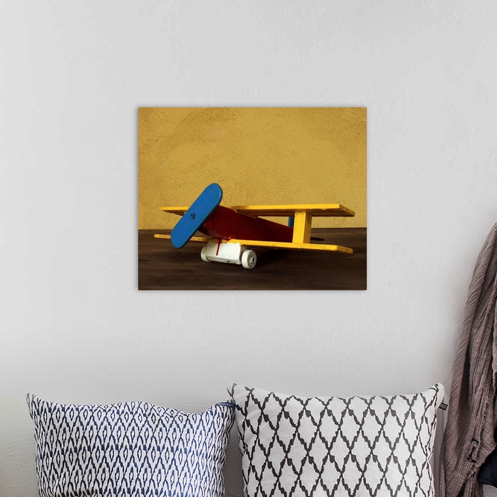 A bohemian room featuring Toy wooden airplane