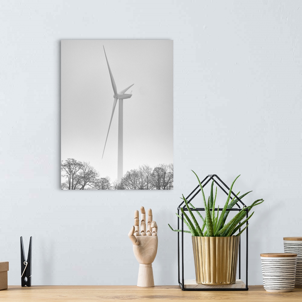 A bohemian room featuring England, Northumberland, Plessey Woods Country Park. Wind Turbine on a foggy day, located alongsi...