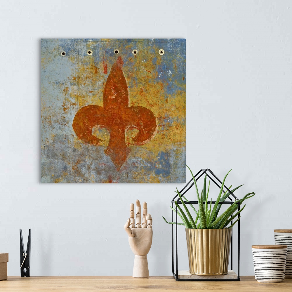 A bohemian room featuring Square abstract painting of a sienna orange fleur de lis on a blue, grey, and yellow background.
