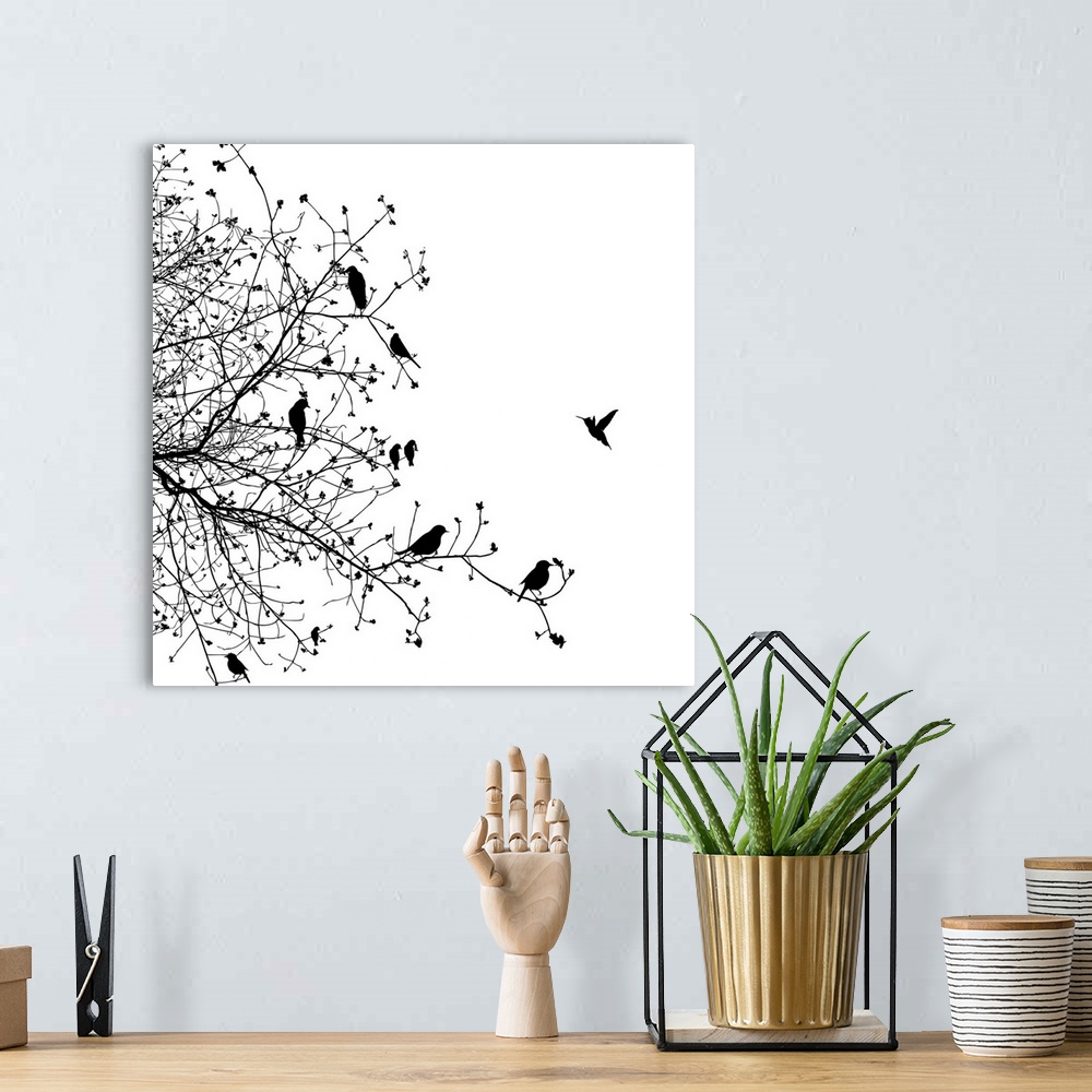 A bohemian room featuring A black and white illustration of a group of birds sitting on a tree branch.