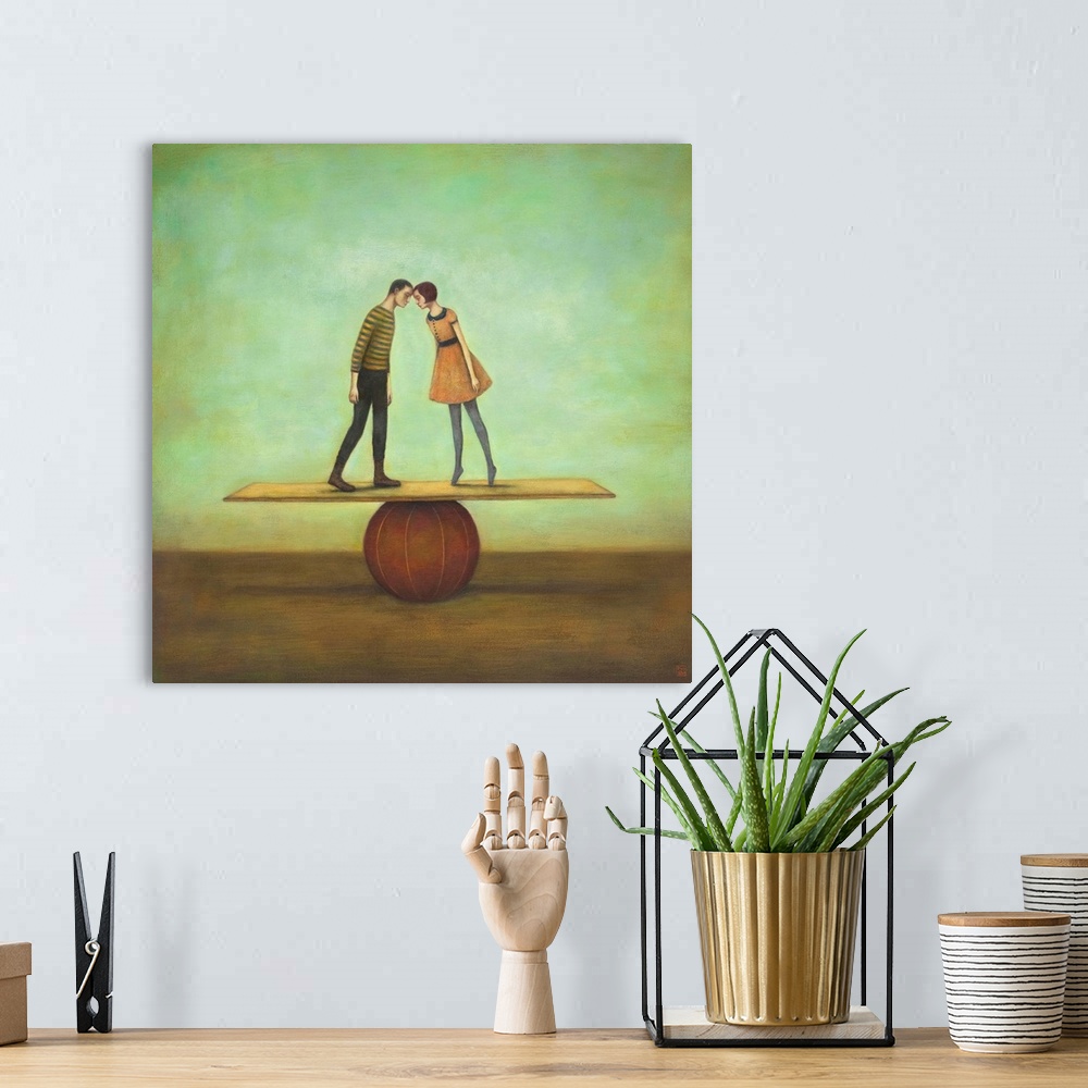 A bohemian room featuring Contemporary surreal artwork of a woman and man kissing on a plank balancing on a red ball.