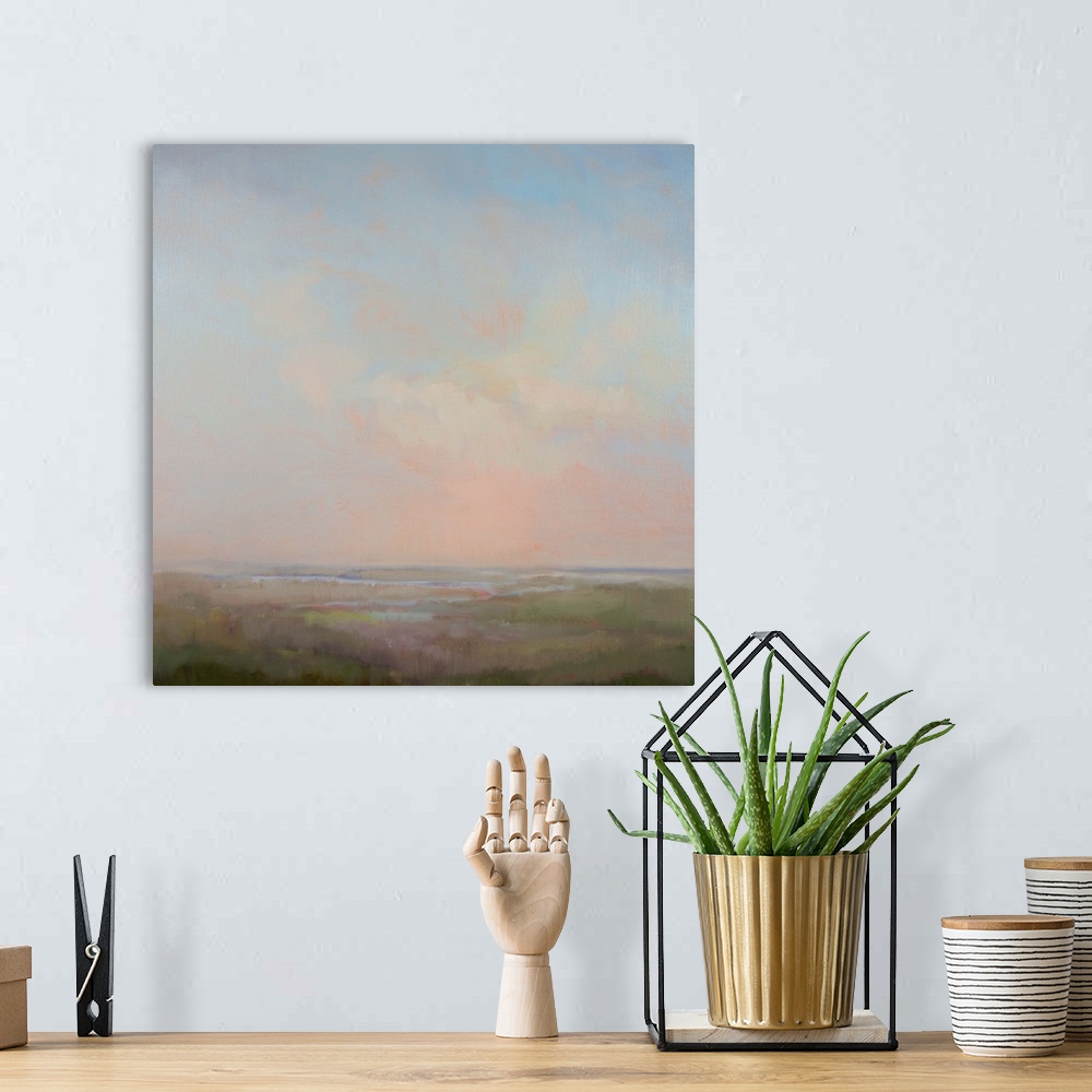 A bohemian room featuring Contemporary landscape painting with cloudy skies above.