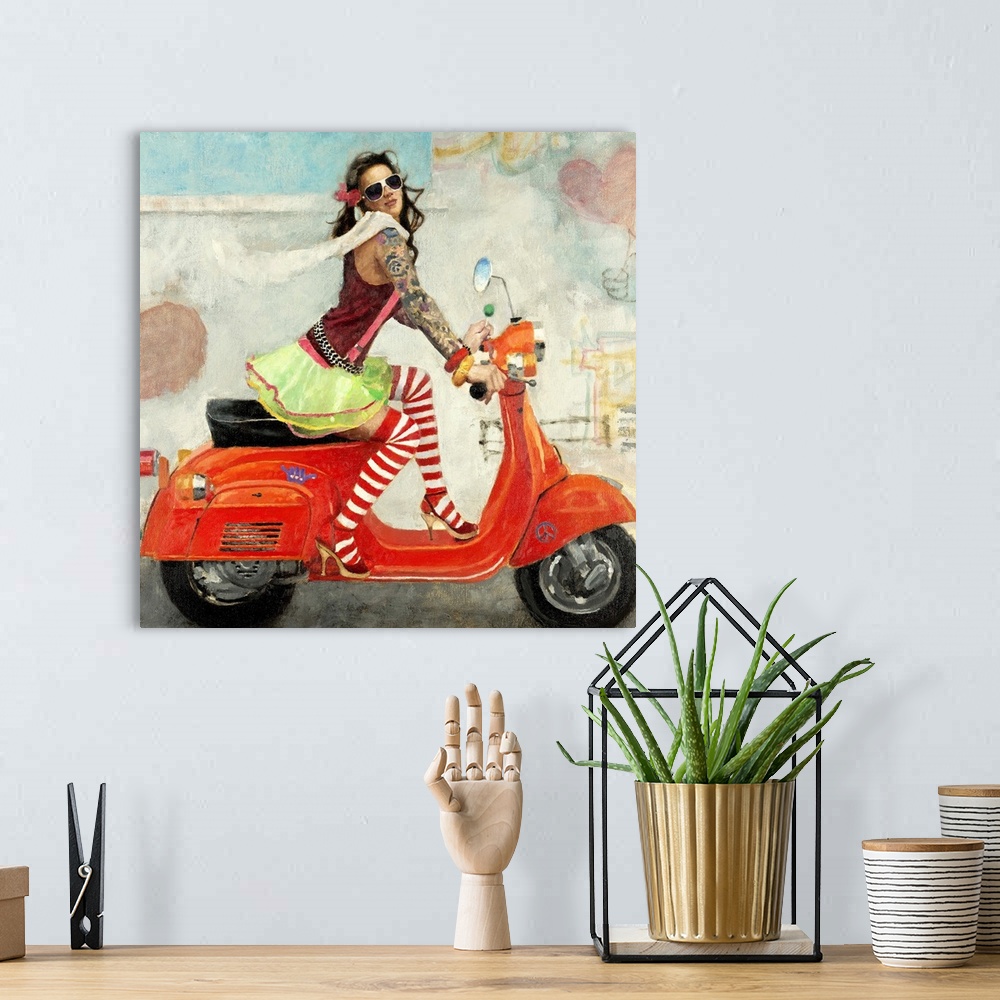 A bohemian room featuring Contemporary artwork of a woman wearing mismatched clothing riding a bright red scooter.