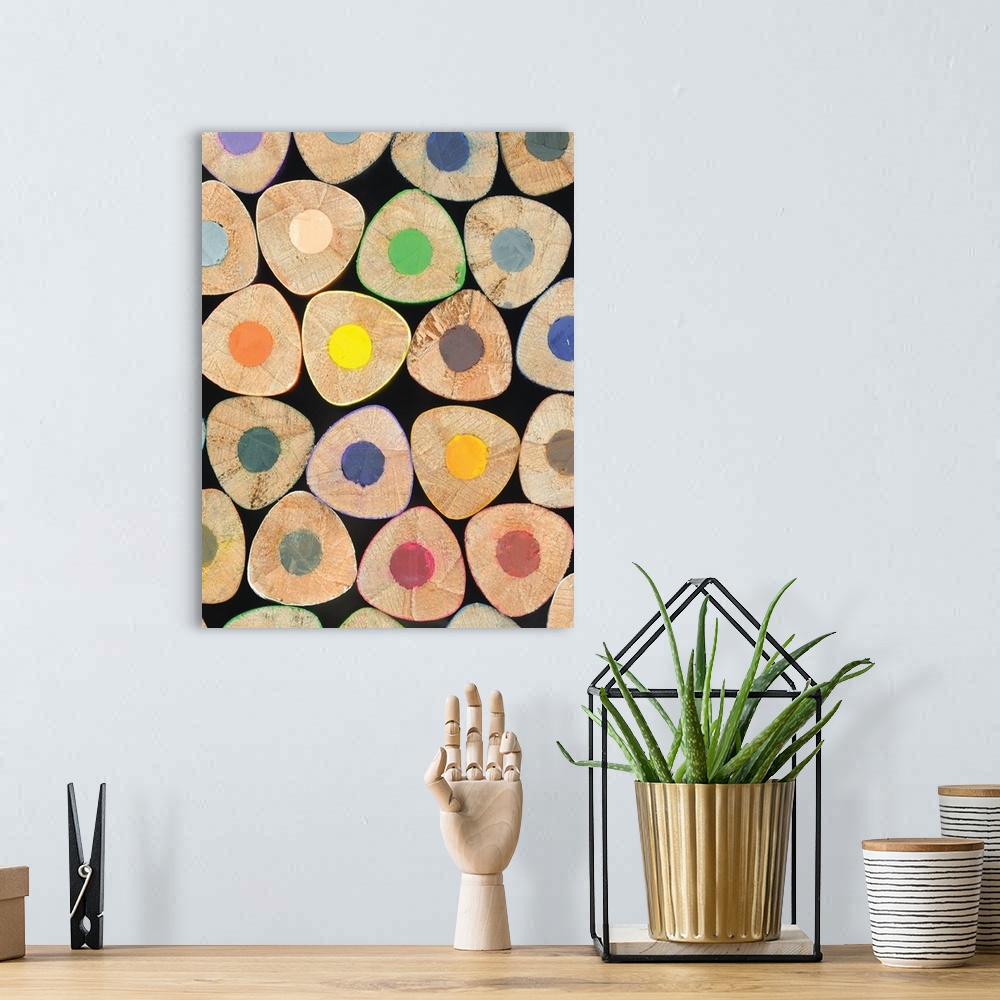 A bohemian room featuring Close up photograph of ends of stacked colored pencils.