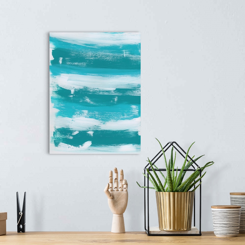A bohemian room featuring Vertical abstract landscape painting of an ocean using sweeping horizontal brush strokes in blue ...