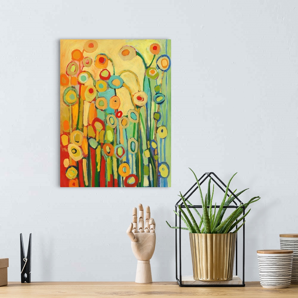 A bohemian room featuring Vertical, abstract painting of simplified flower shapes in a kaleidoscope of colors.