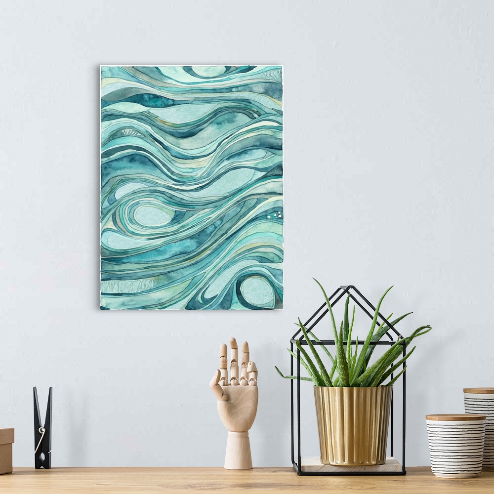 A bohemian room featuring Contemporary abstract watercolor artwork in blue shades, resembling waves of flowing water.