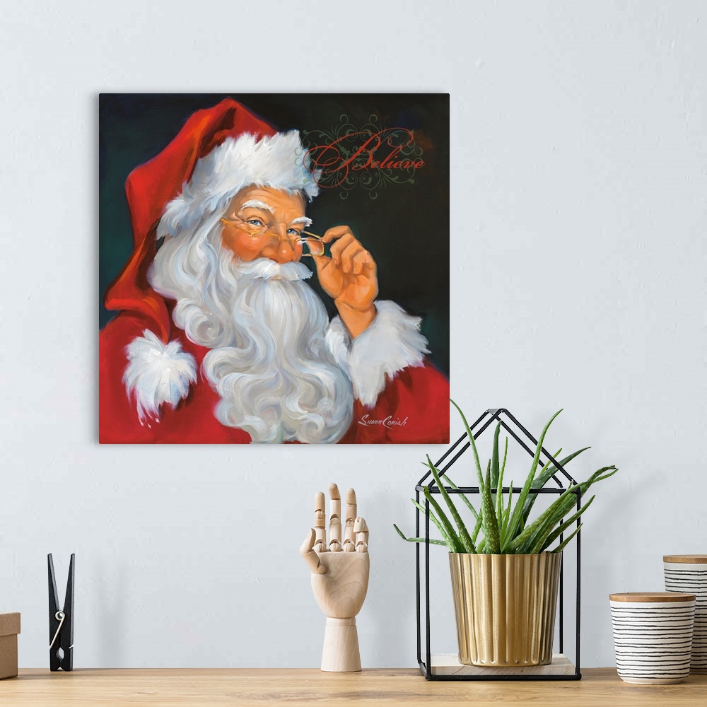 A bohemian room featuring Fine art painting of Santa Claus in a red suit with the word "Believe"  above his head.