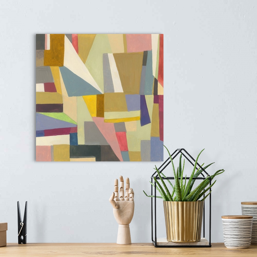 A bohemian room featuring One painting in a series of geometric abstracts with mostly muted colors depicting the artist's i...
