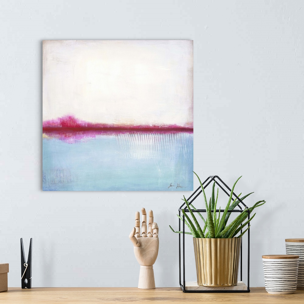 A bohemian room featuring Square, abstract painting featuring large blocks of color in white and light blue with pink accents