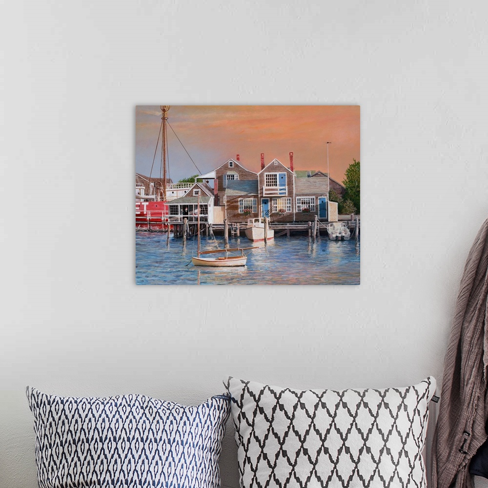 A bohemian room featuring Houses on harbor wharf with dock and moored boats at sunrise.