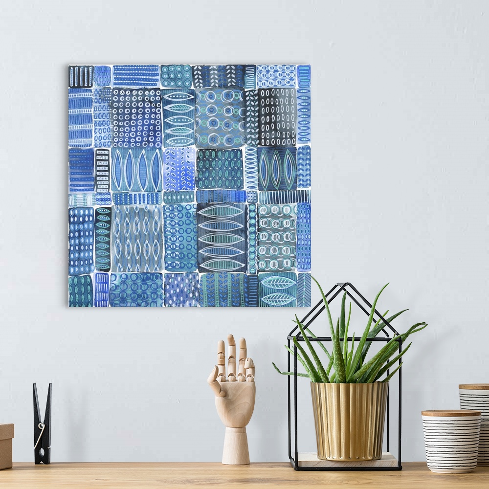 A bohemian room featuring Abstract batik patterns in shades of indigo, cobalt, teal and gray, Shibori inspired.