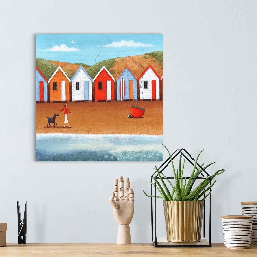 A bohemian room featuring Contemporary painting of a woman walking a dog along a beach with a row of huts.
