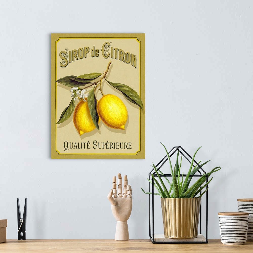 A bohemian room featuring Large print of an a French advertisement with two lemons on a branch.