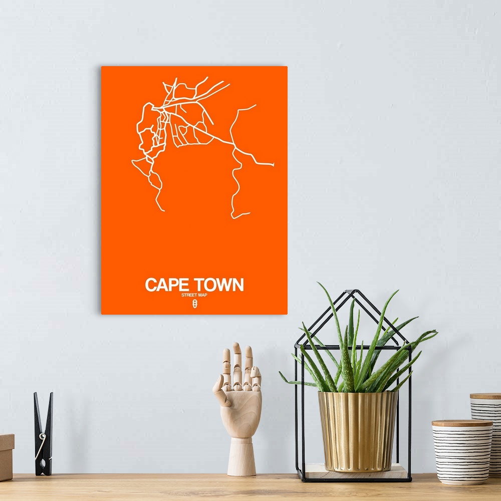 A bohemian room featuring Minimalist art map of the city streets of Cape Town in orange and white.