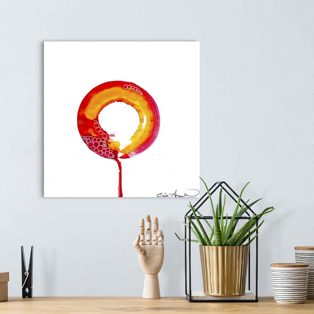 A bohemian room featuring Ripples of shadow emanate from a bright red and yellow orange enso or circle. One lone drip escap...