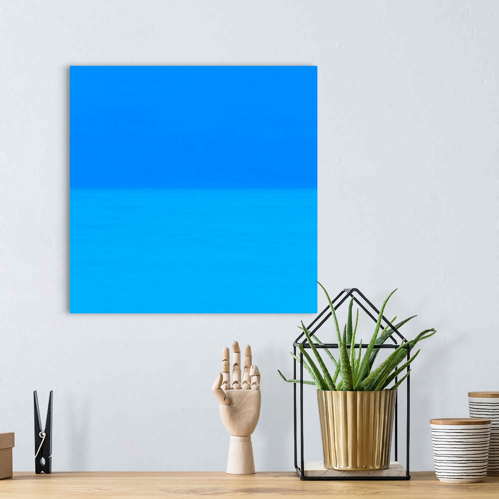 A bohemian room featuring Abstract photograph of two layers of deep blue.