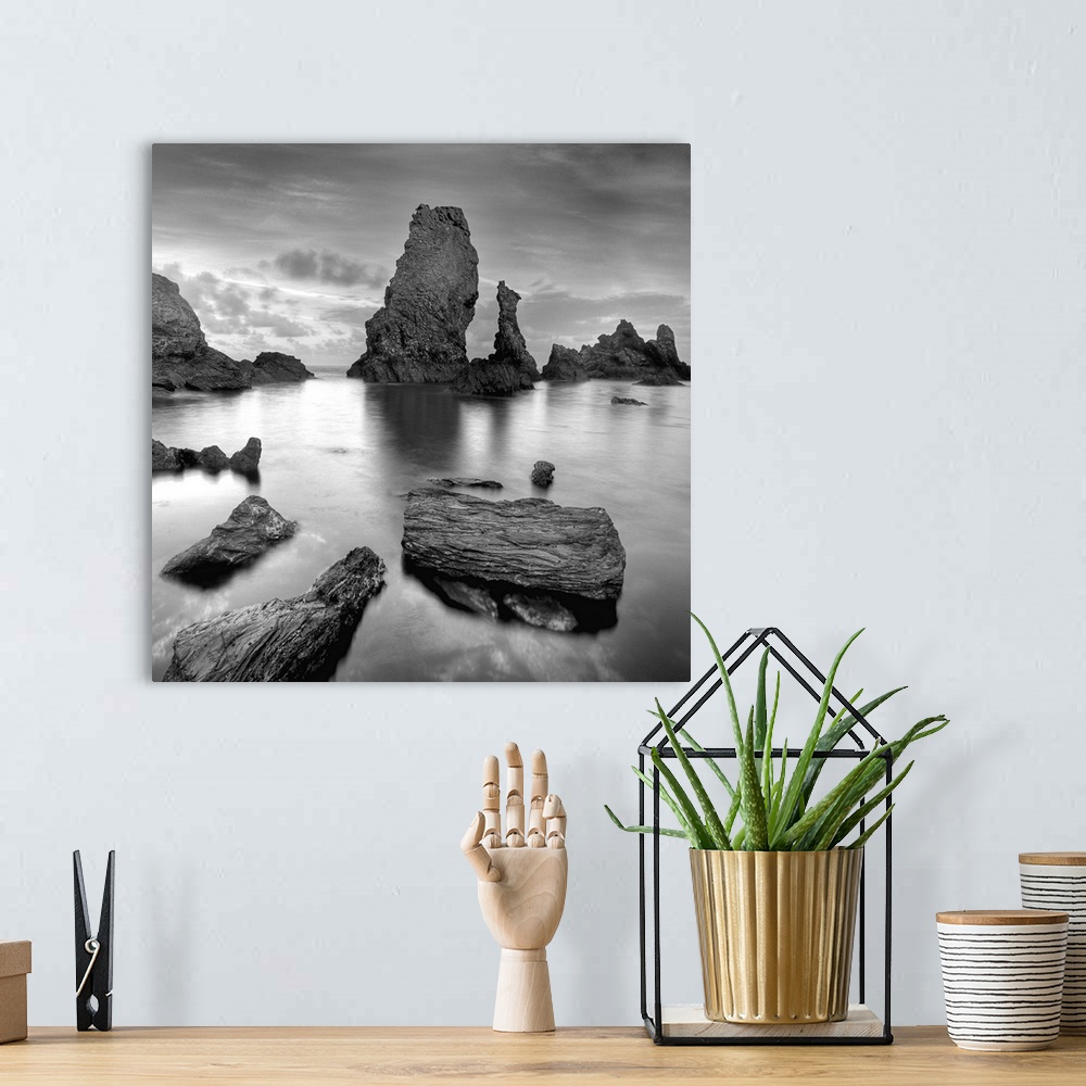 A bohemian room featuring Big natural rocks in Belle Ile en Mer beach called Port coton in France, Brittany, black and whit...