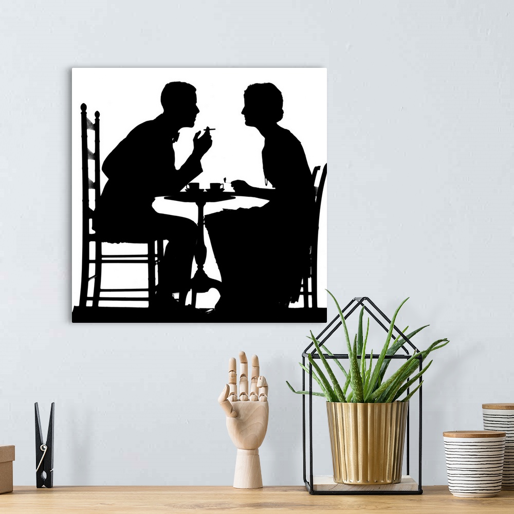 A bohemian room featuring 1930's Silhouette Of Couple Sitting At Tea Table