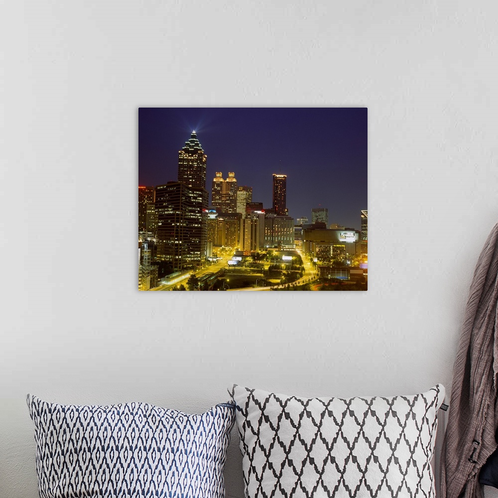 A bohemian room featuring Large photograph displays a busy capital city in the Southeastern United States as the lights of ...