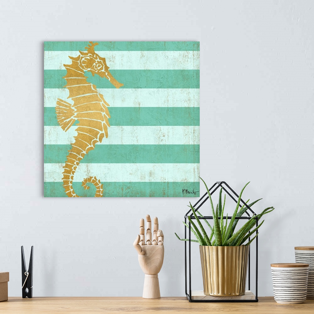 A bohemian room featuring Square decor with a metallic gold seahorse on a blue striped background.