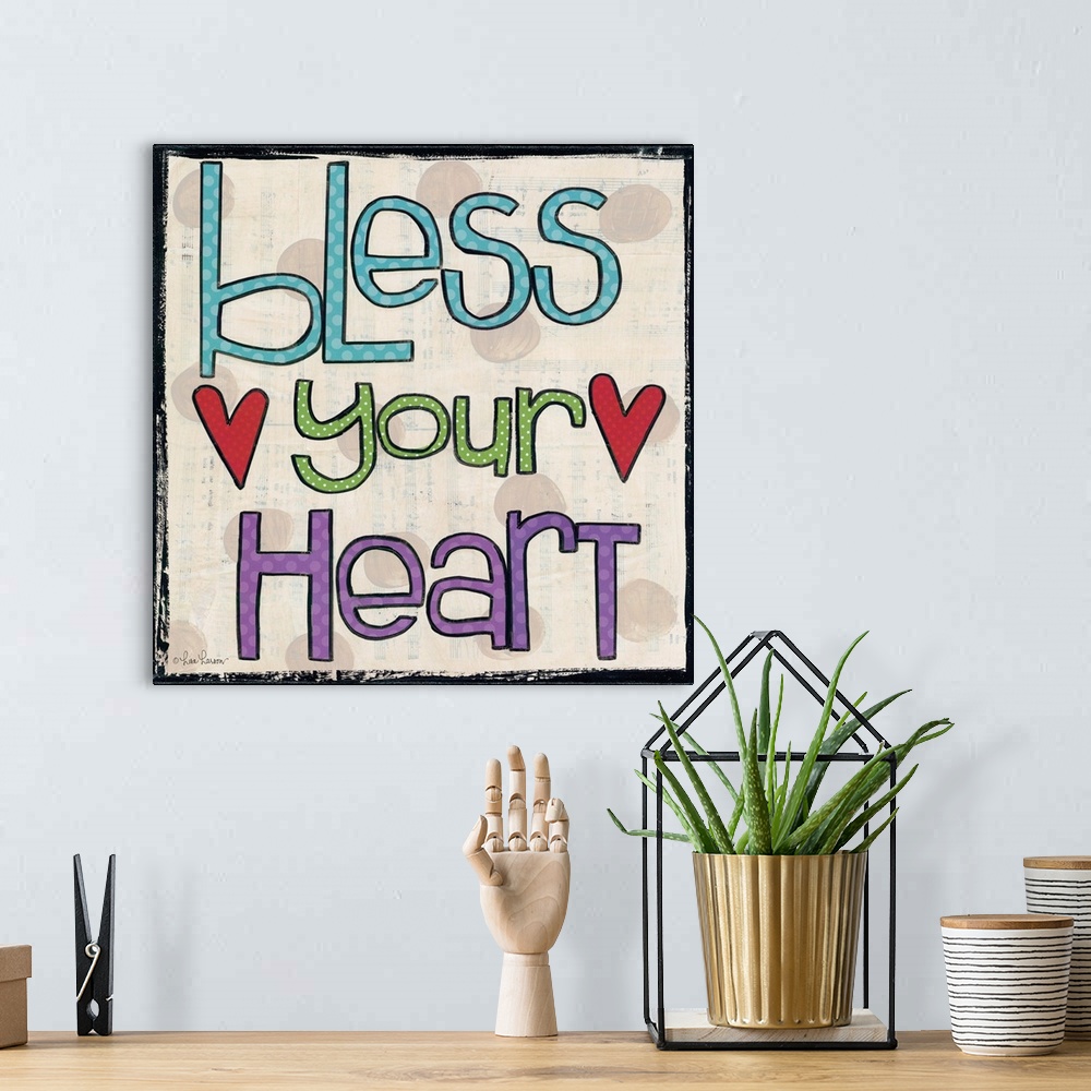 A bohemian room featuring Handwritten typography art reading "bless your heart" with two red hearts.