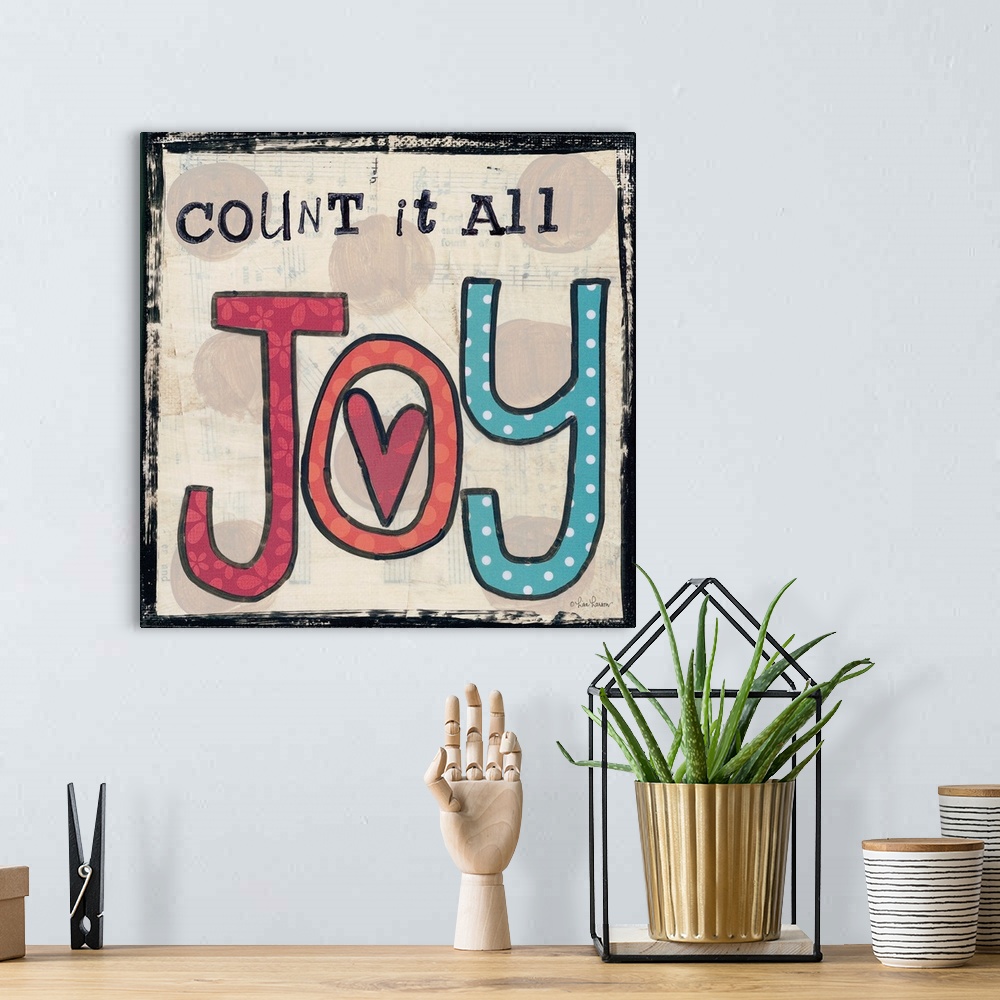 A bohemian room featuring Handwritten typography art reading "Count it all Joy," with a heart in the center.