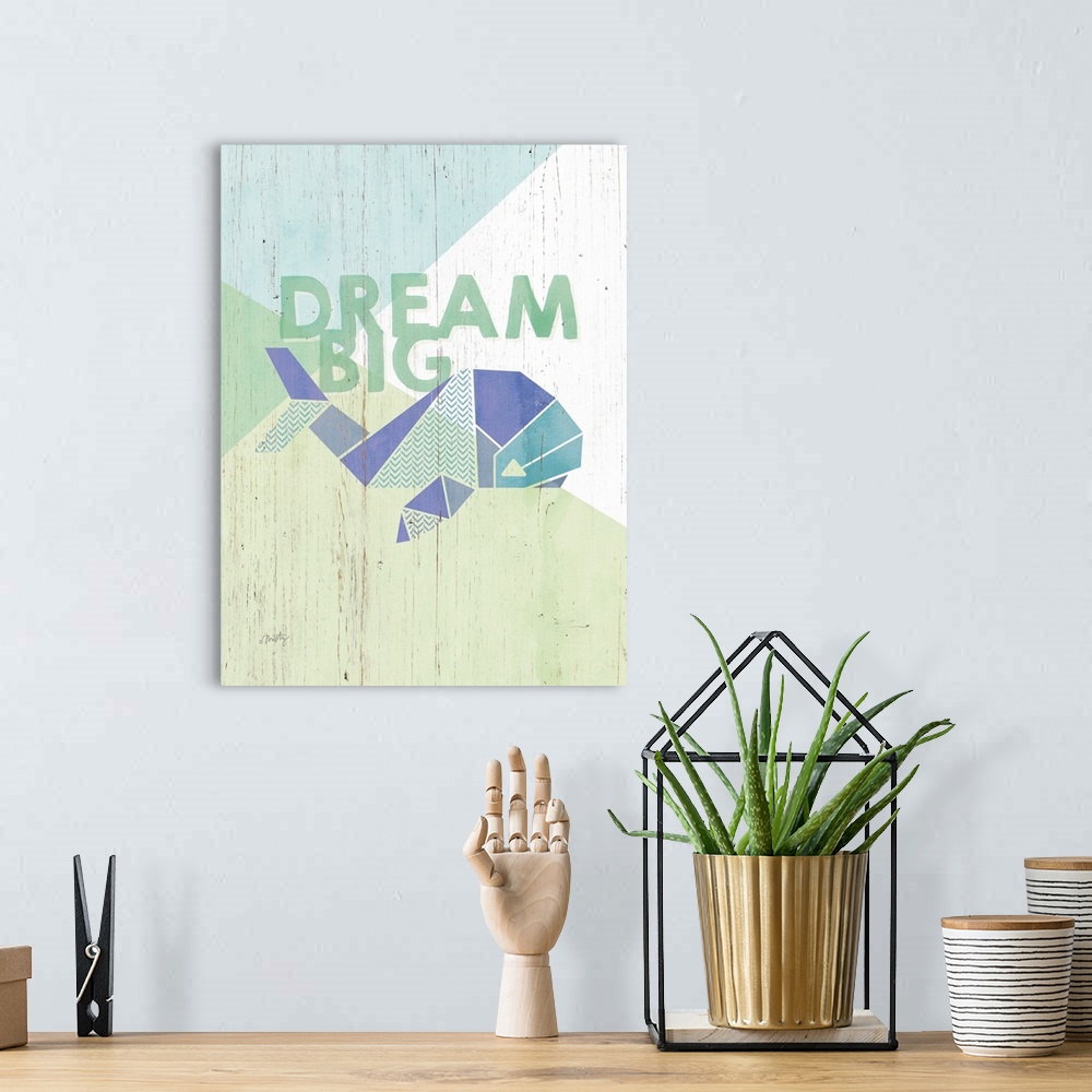 A bohemian room featuring Children's artwork of geometric whale with the words: Dream Big.