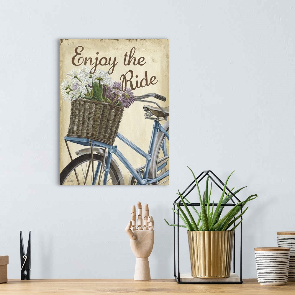 A bohemian room featuring Illustration of a blue bicycle with a basket full of flowers and the text "Enjoy the Ride."