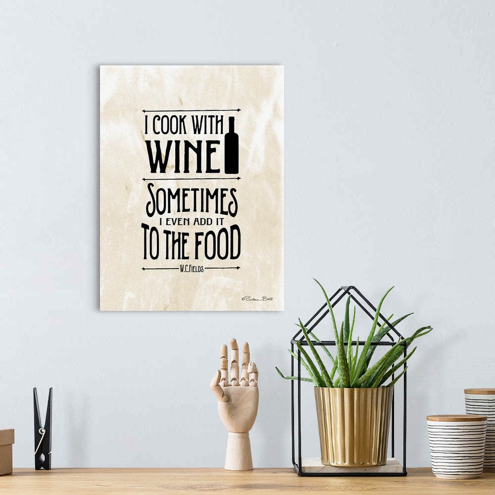 A bohemian room featuring Humorous artwork reading "I cook with wine, sometimes I even add it to food" in black text on a b...