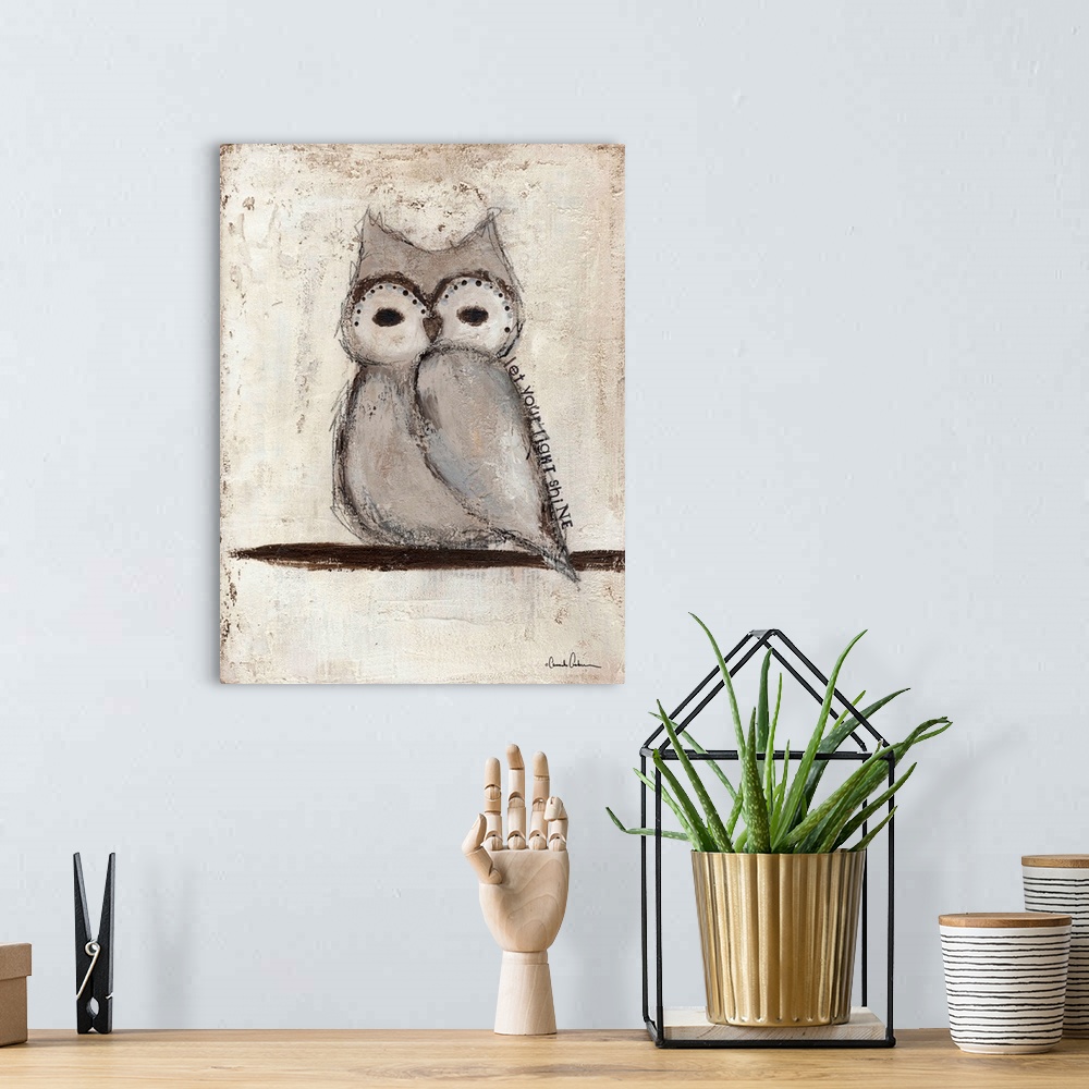 A bohemian room featuring Painting of a small grey owl with large round eyes.
