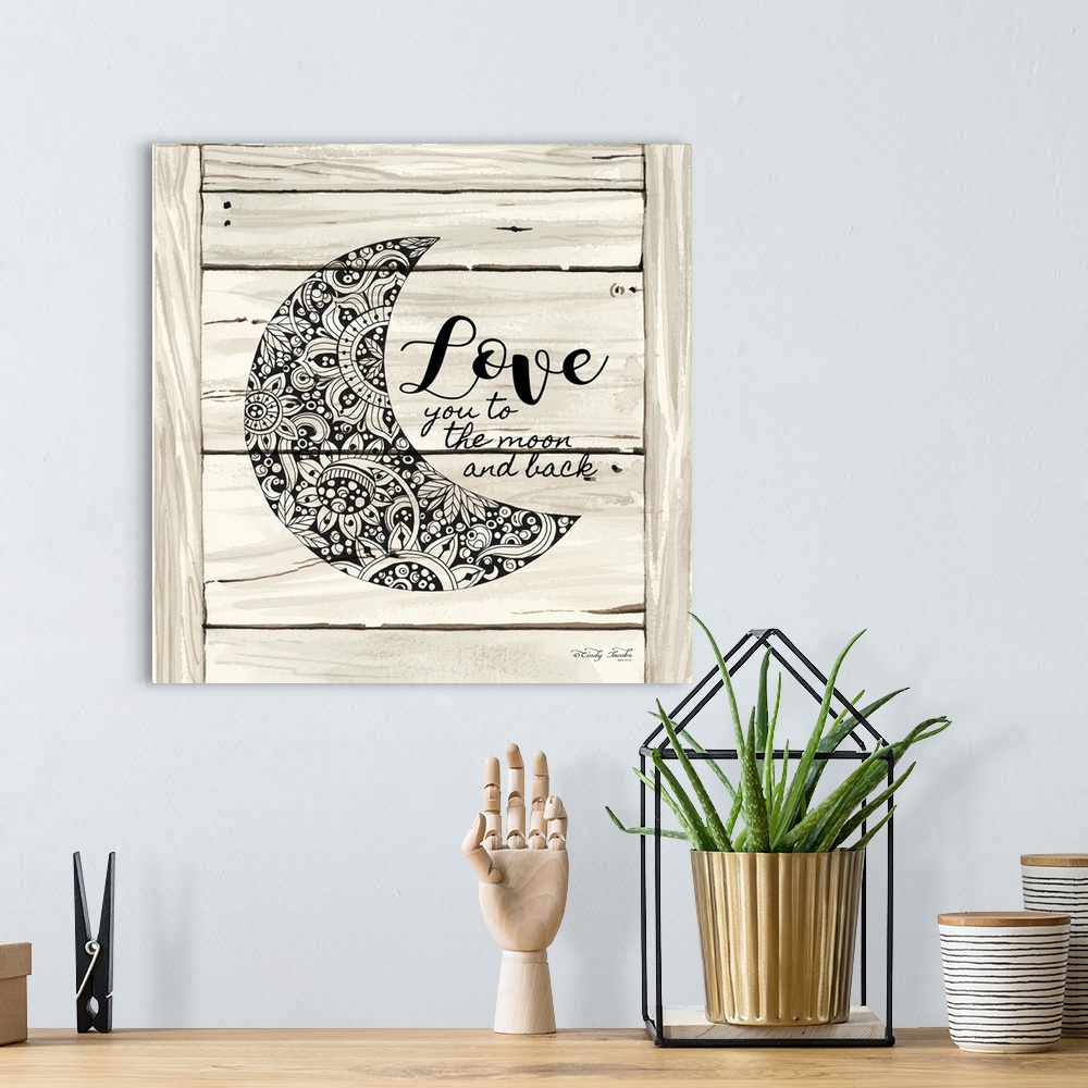 A bohemian room featuring Moon with a floral lace pattern on a white wooden board background.