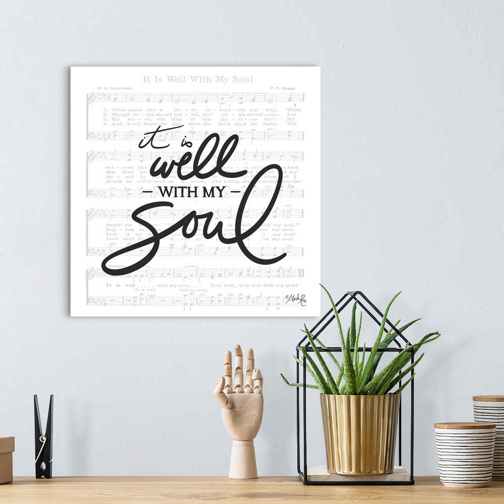 A bohemian room featuring Typography of the phrased "it is well with  my soul" with the sheet music for It is Well with My ...