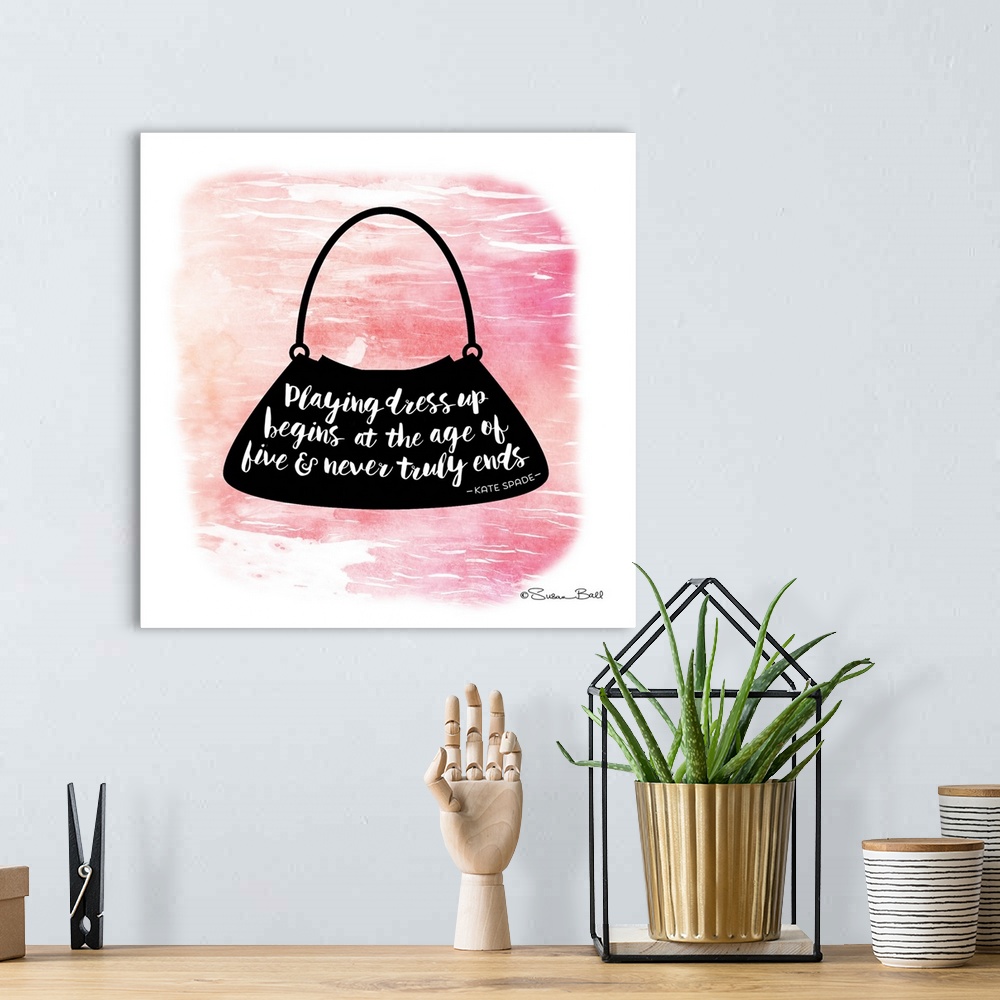 A bohemian room featuring Silhouette of a purse with a motivational quote hand-lettered in white script, over a pink waterc...