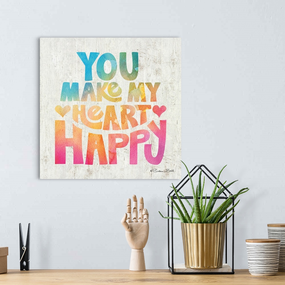 A bohemian room featuring Sweet, loving sentiment in bold lettering in rainbow watercolors.