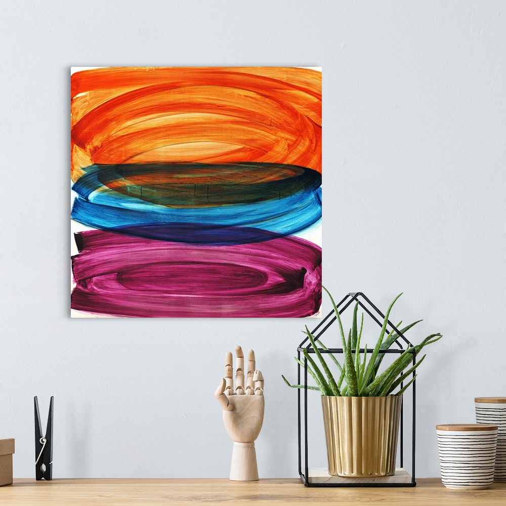A bohemian room featuring Abstract painting of three large oval shapes that are vertically stacked, each in a different col...