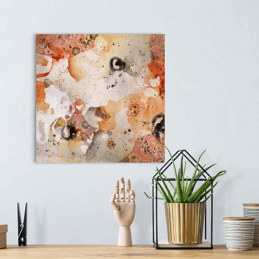 A bohemian room featuring Abstract painting using bright orange tones in splashes and splatters, almost looking like flowers.