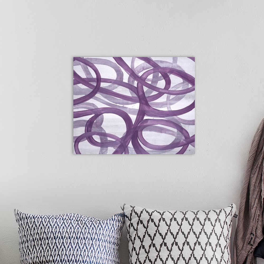 A bohemian room featuring A compelling painting of free flowing curved lines in purple.