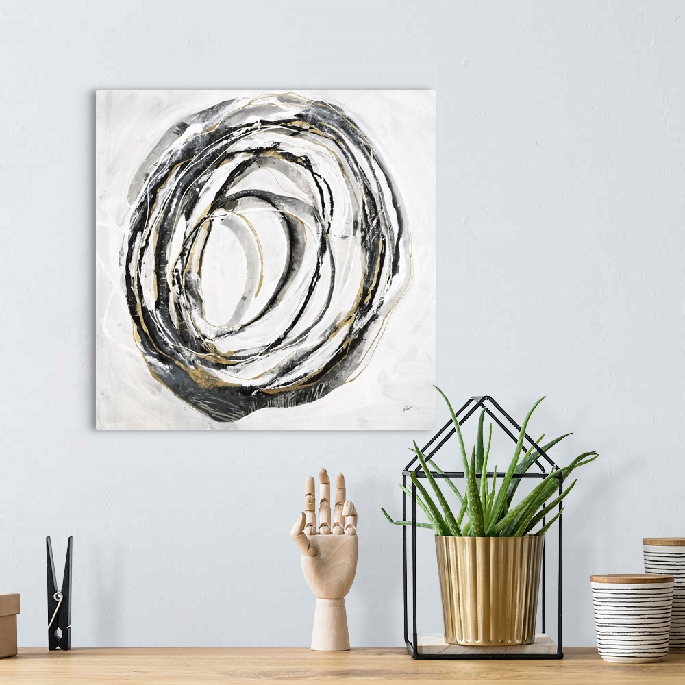 A bohemian room featuring Square abstract art with thin black, gray, and gold lines making one big circle in the center of ...