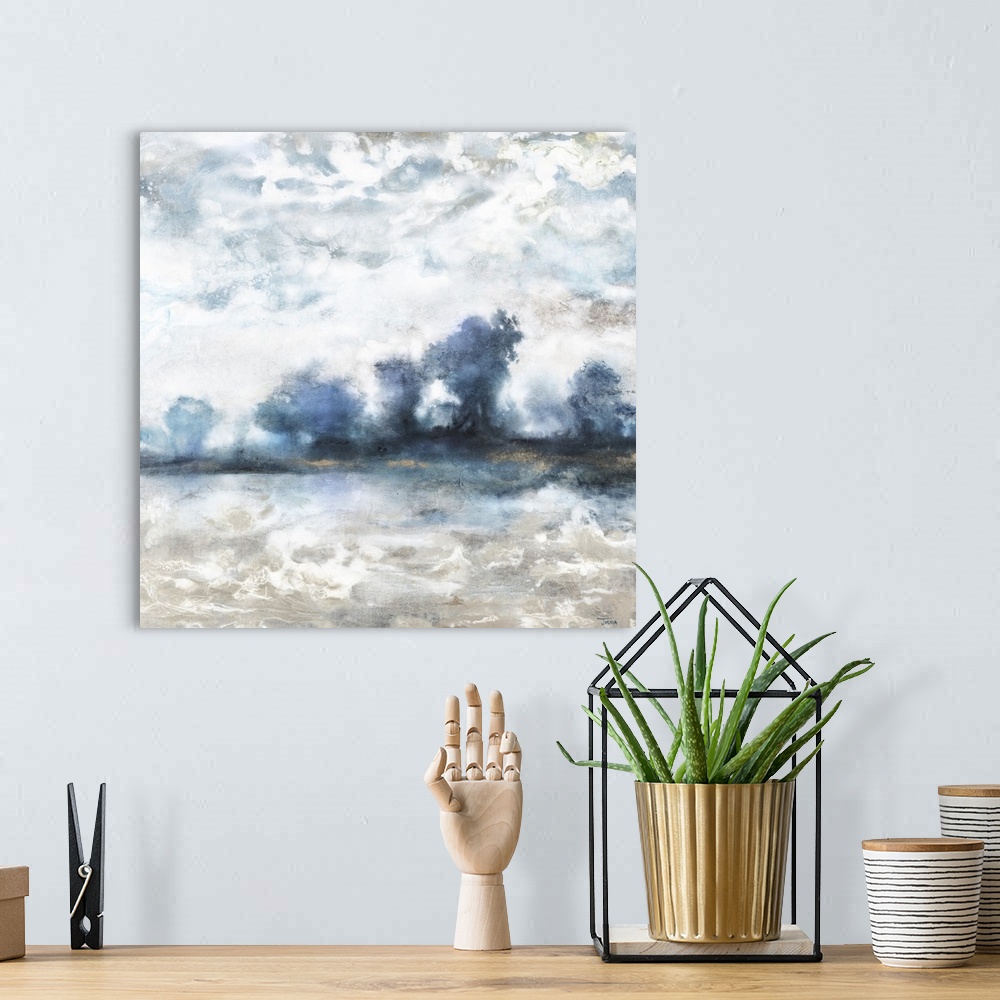 A bohemian room featuring Square abstract landscape painting of a tree line on the horizon in shades of blue and white, bro...