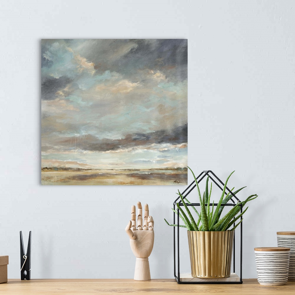 A bohemian room featuring Abstract painting of storm clouds moving into a thick sky of clouds over a vast, empty landscape.