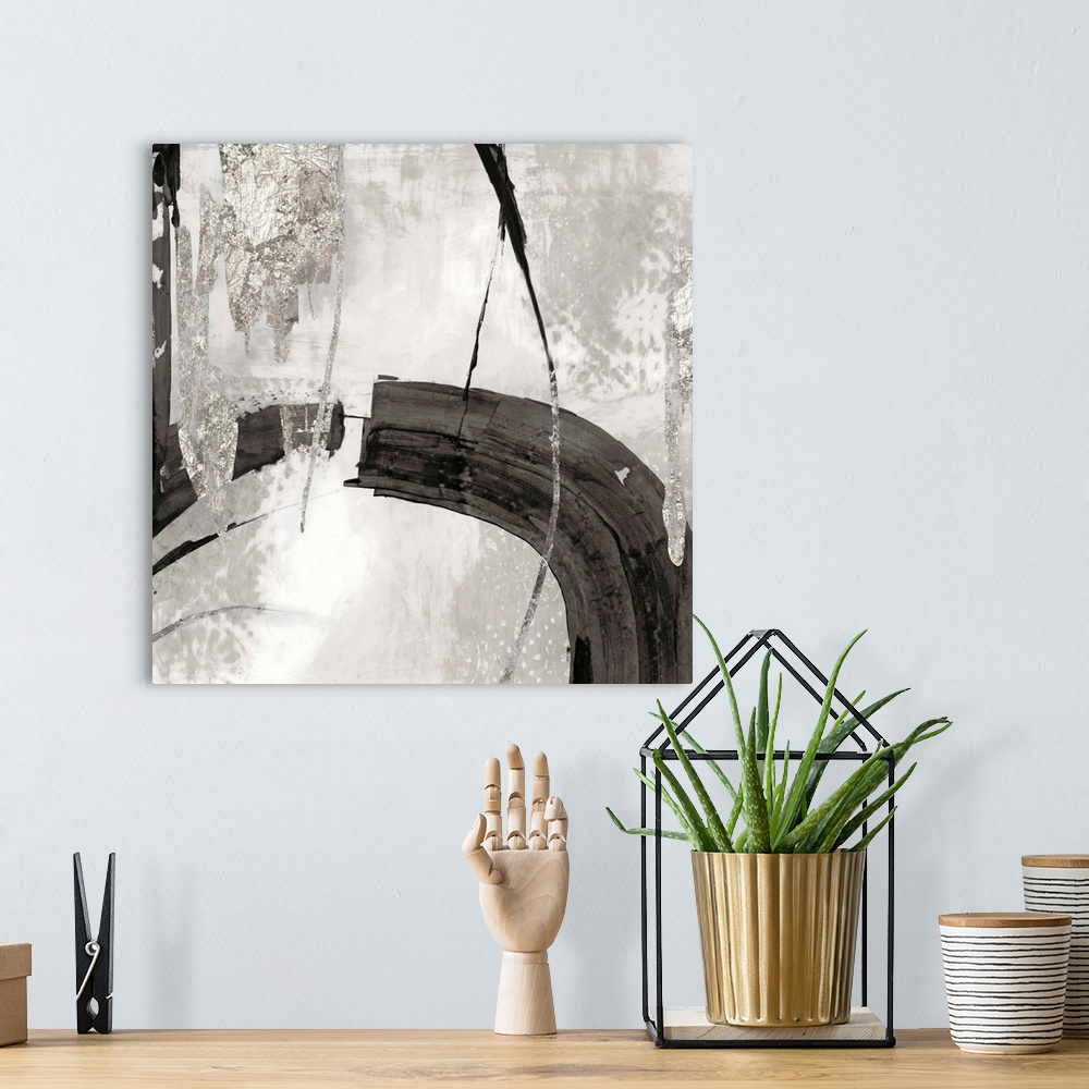 A bohemian room featuring Silver abstract artwork intersected by a black streak.