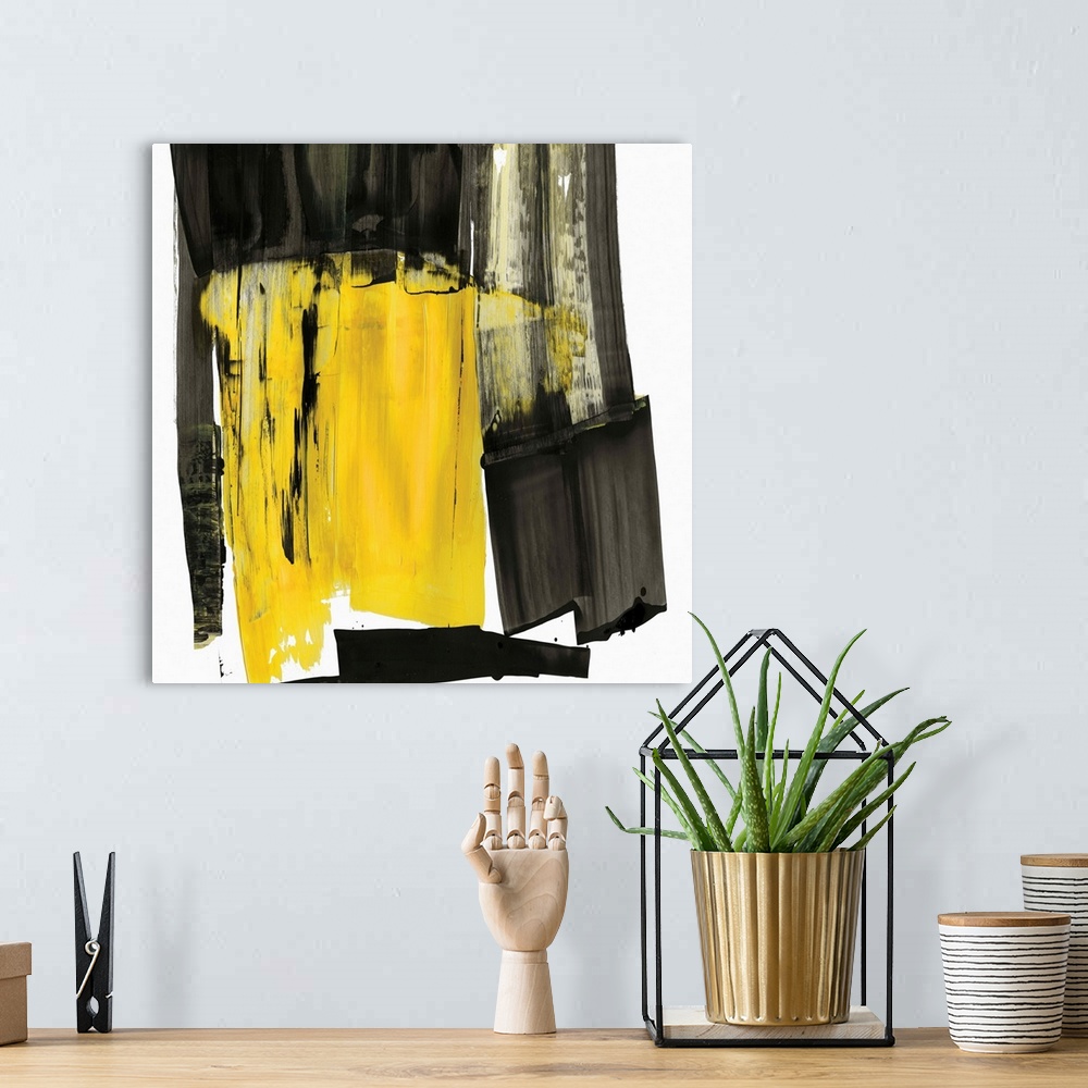 A bohemian room featuring Contemporary abstract artwork in black and grey with a pop of bright yellow.