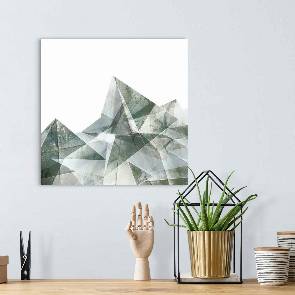 A bohemian room featuring Square painting of gray abstract geometric shapes.