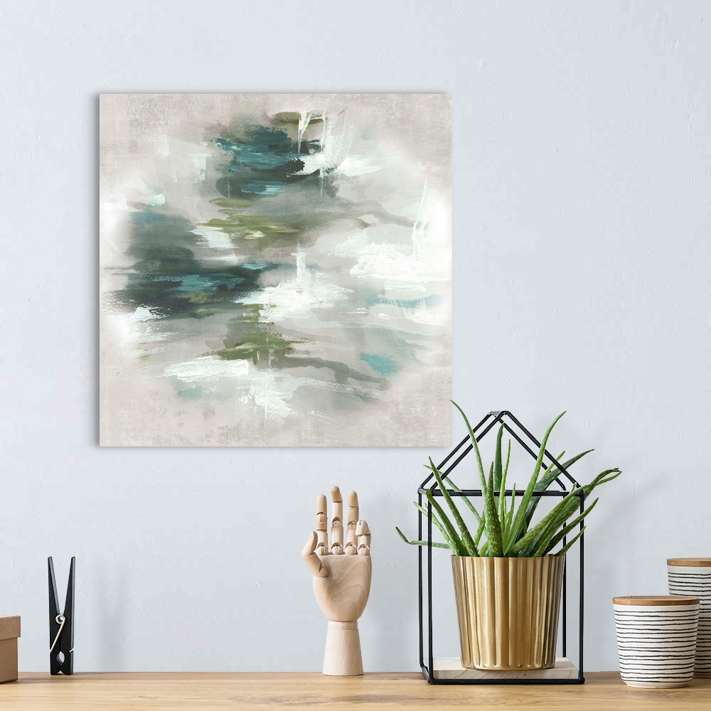 A bohemian room featuring Abstract artwork with different shades of green in the center that fades to a light gray.