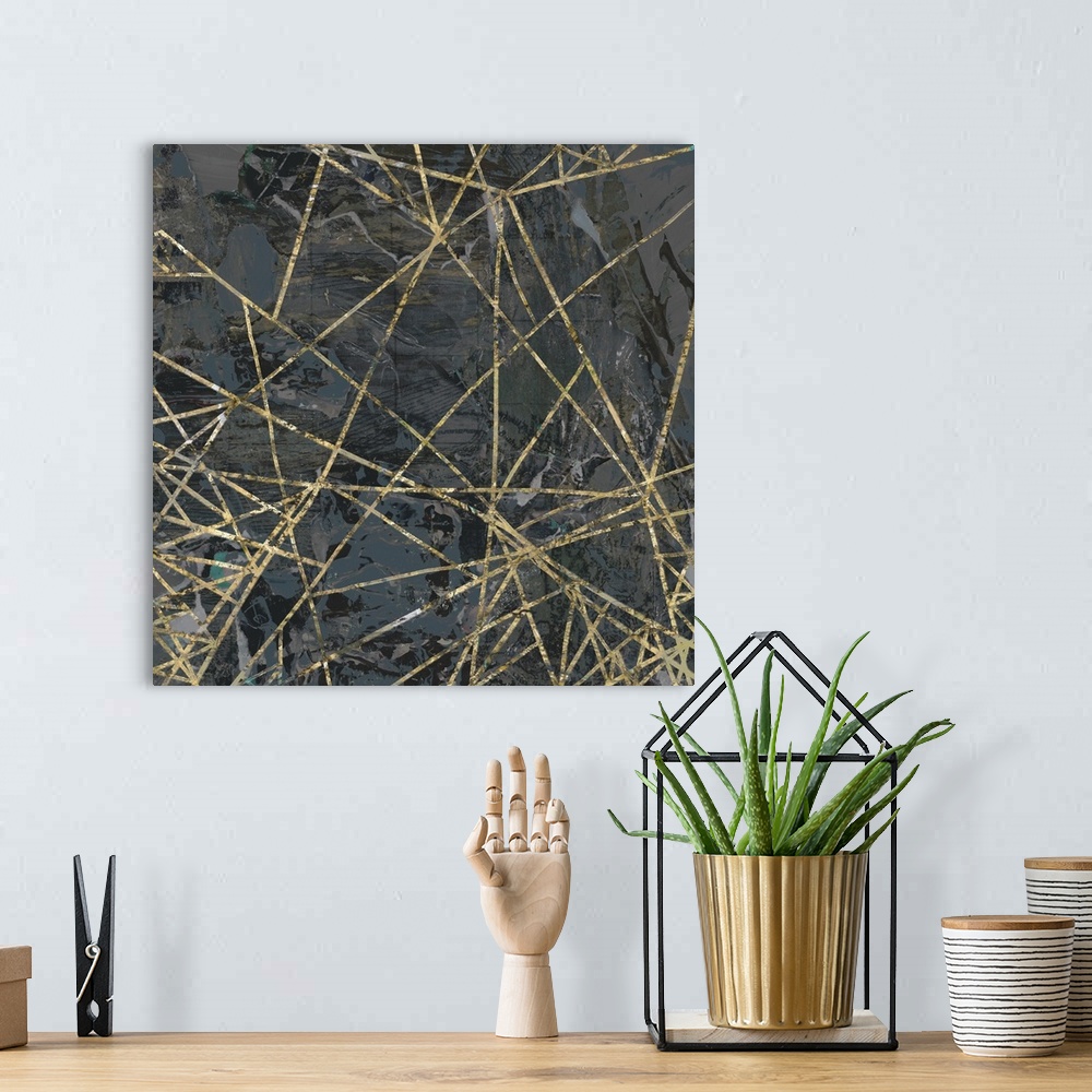 A bohemian room featuring A square abstract painting of textured gold lines over a dark gray background
