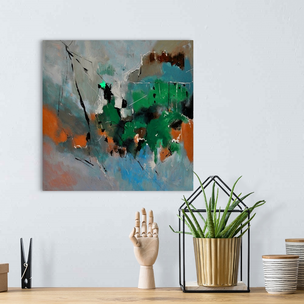 A bohemian room featuring A square abstract painting in dark shades of green, blue and brown with splatters of paint overla...